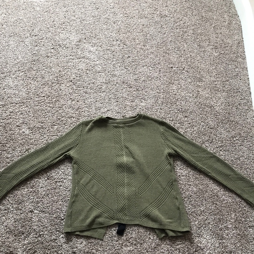 Green sweater with back cut out